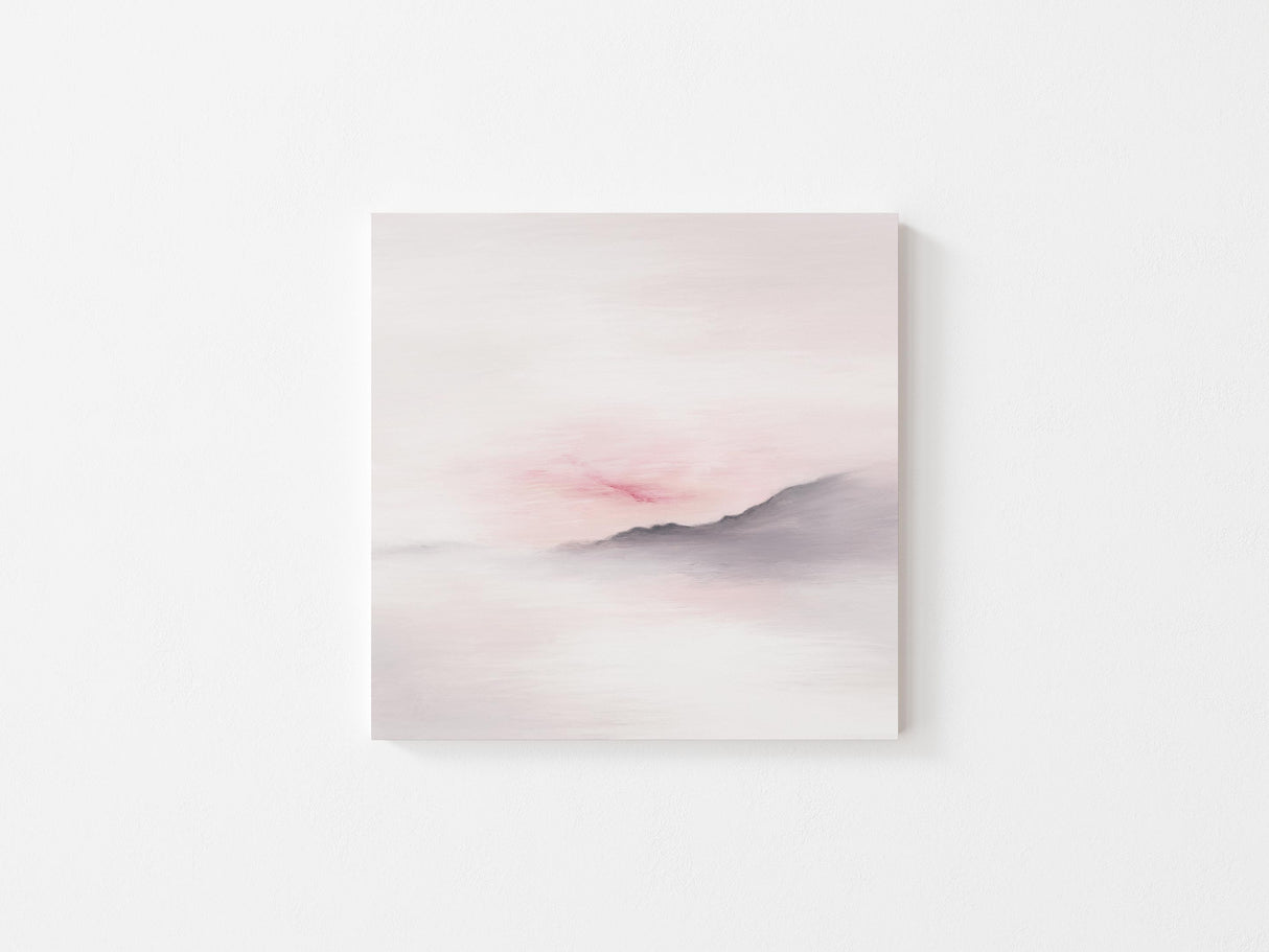 Tranquil pink sunset behind a gentle hillside.