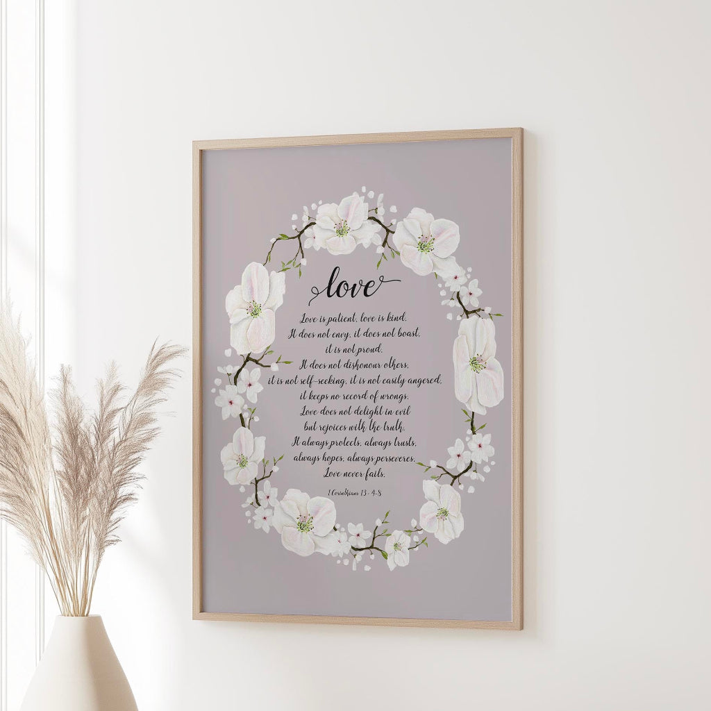 Floral wreath wall art featuring Bible verse from 1 Corinthians 13 on love, kindness, and commitment.
