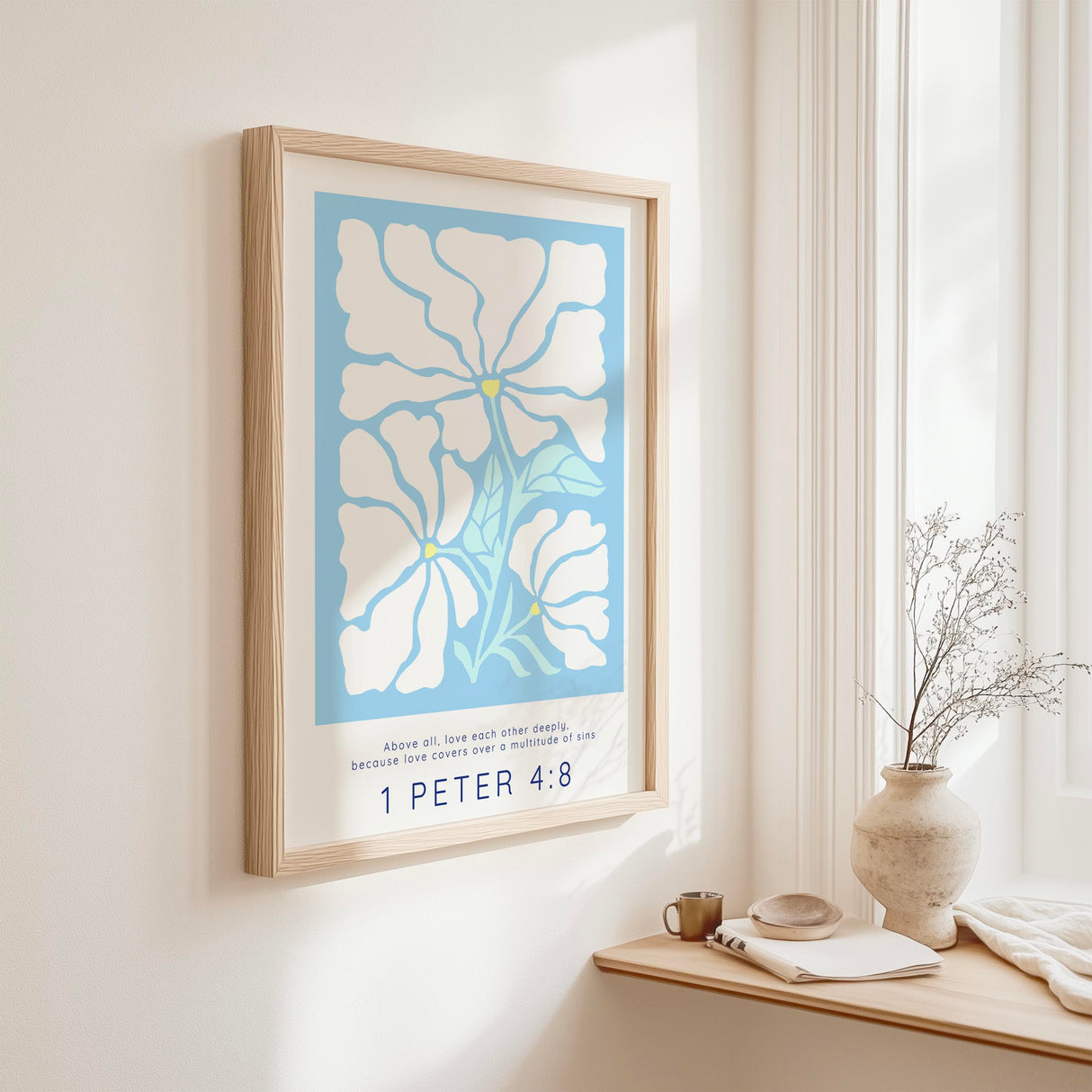 Bible verse print with 1 Peter 4:8 and floral artwork on a light blue background, encouraging deep love and grace.