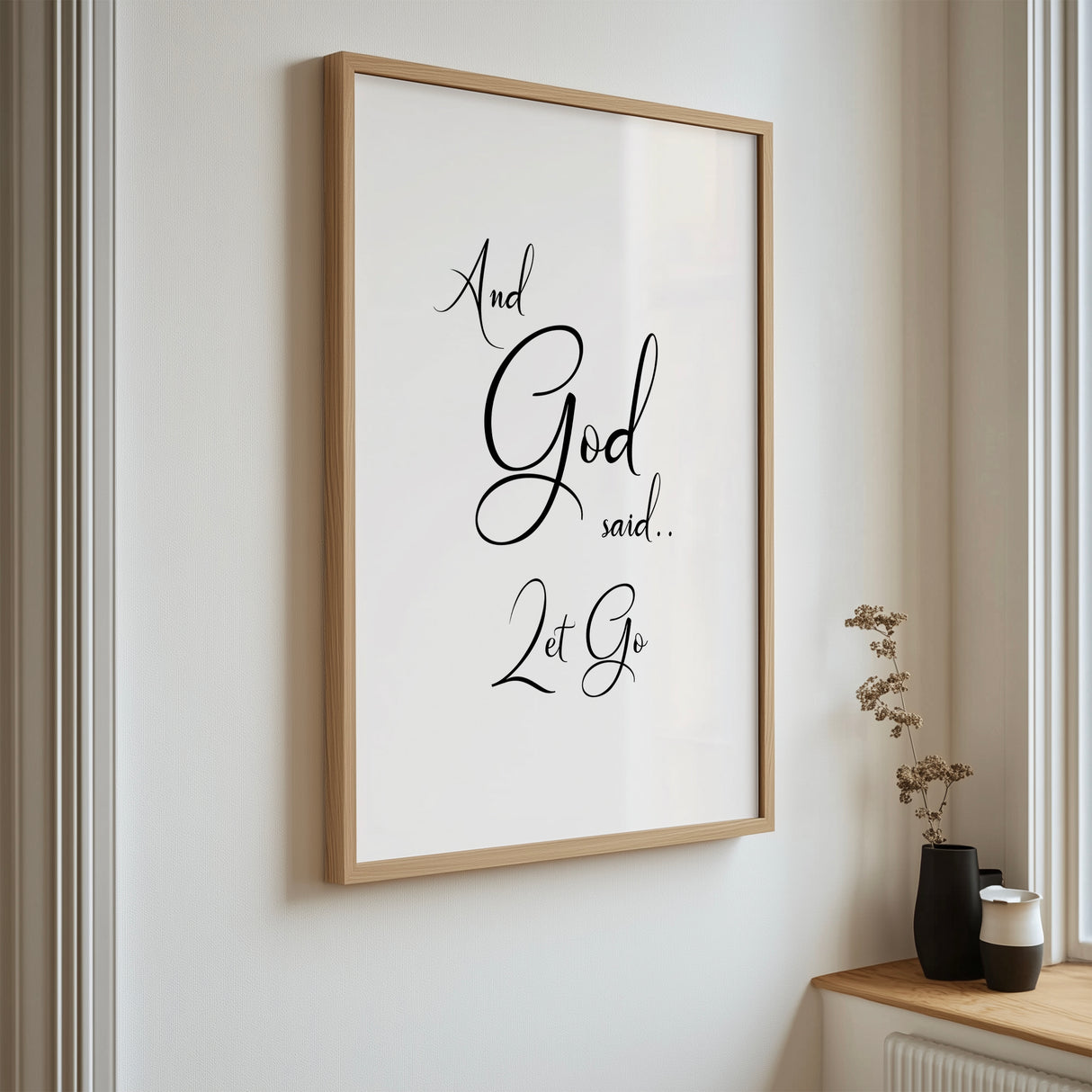 Elegant black and white Bible verse art print featuring the quote "And God said let go" for home decor.