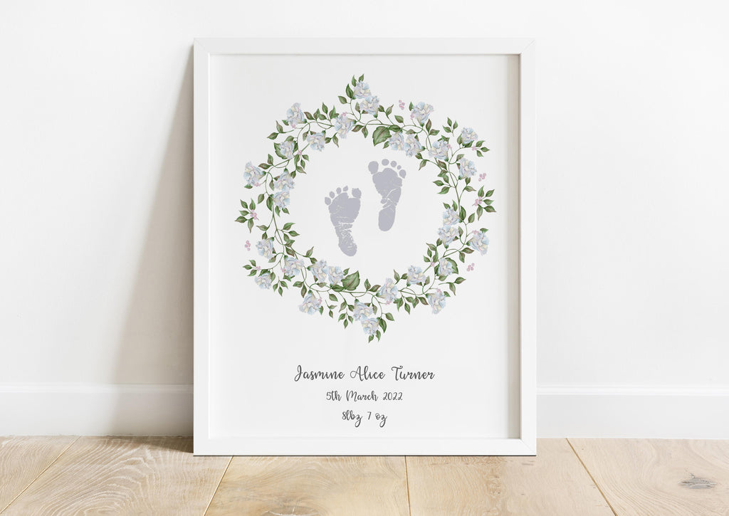 Unique baby footprint birth details artwork, Colorful baby footprint print surrounded by green leaf and white flower wreath