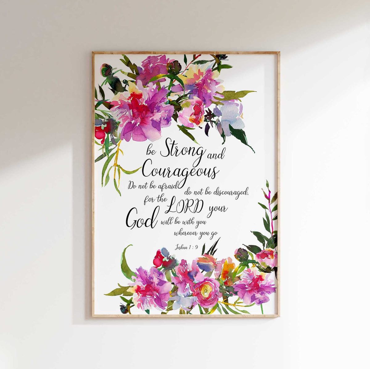 Be Strong And Courageous Christian wall art featuring Joshua 1:9 and pretty pink flowers.
