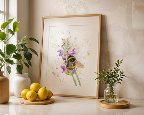 Nature-inspired wall art featuring a detailed bumblebee resting on lavender petals. Hand-painted watercolour print of a bumblebee among lavender flowers, full of charm and movement.