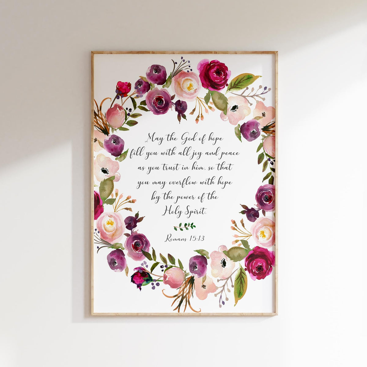 Floral Christian wall art featuring the Bible verse Romans 15:13 surrounded by delicate botanical designs in soft, elegant colours.