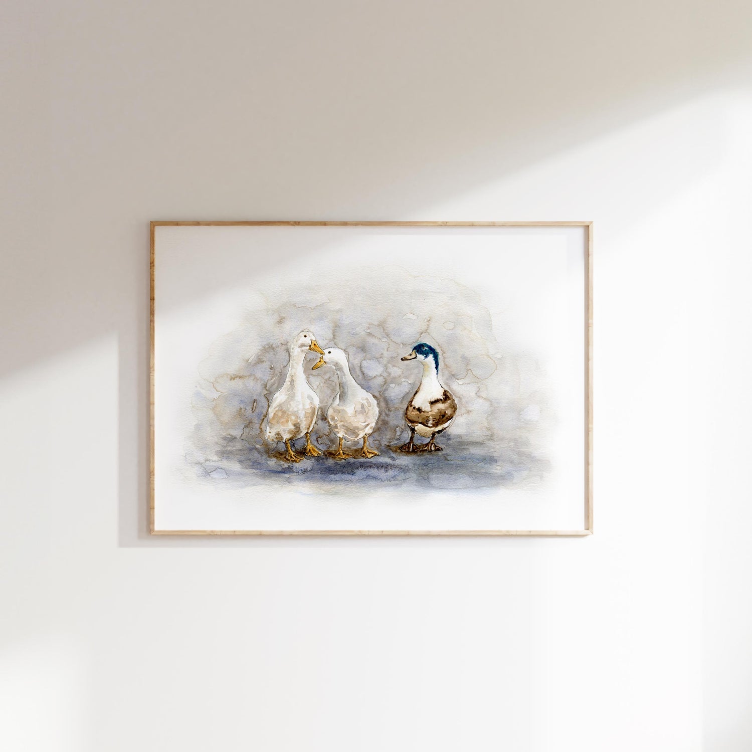 Watercolour duck print featuring three ducks wading in a puddle; Three ducks painted in soft, natural colours on a matt poster print