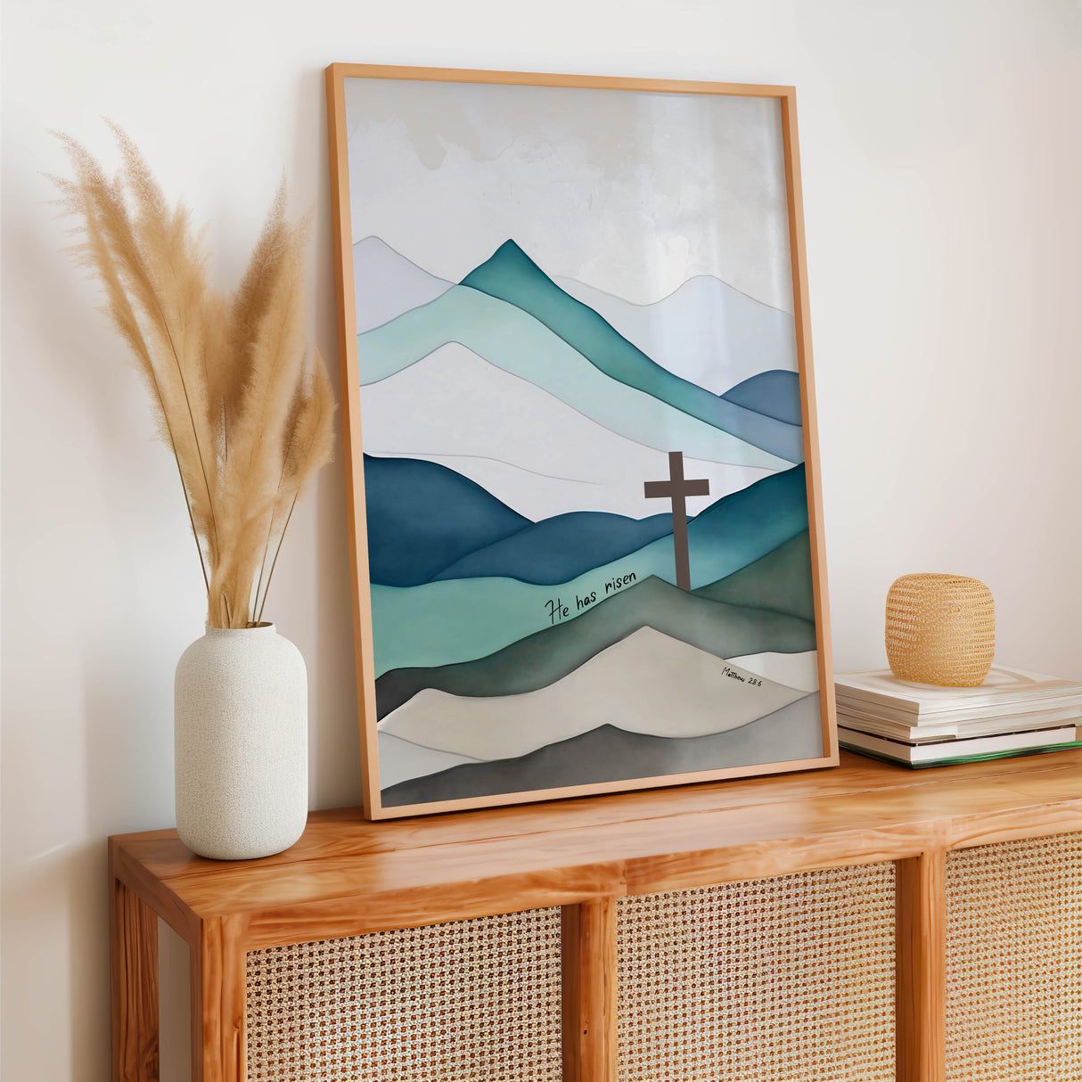 Hand-drawn Jesus cross artwork with Matthew 28:6 scripture over scenic mountain backdrop, blending nature and the message of Christ’s resurrection.