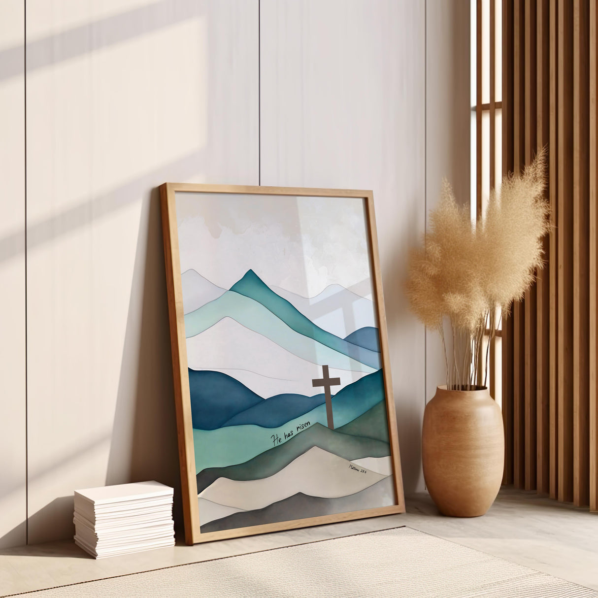Christian wall art featuring a cross on a mountain landscape with the verse “He Has Risen” from Matthew 28:6, symbolising the resurrection.