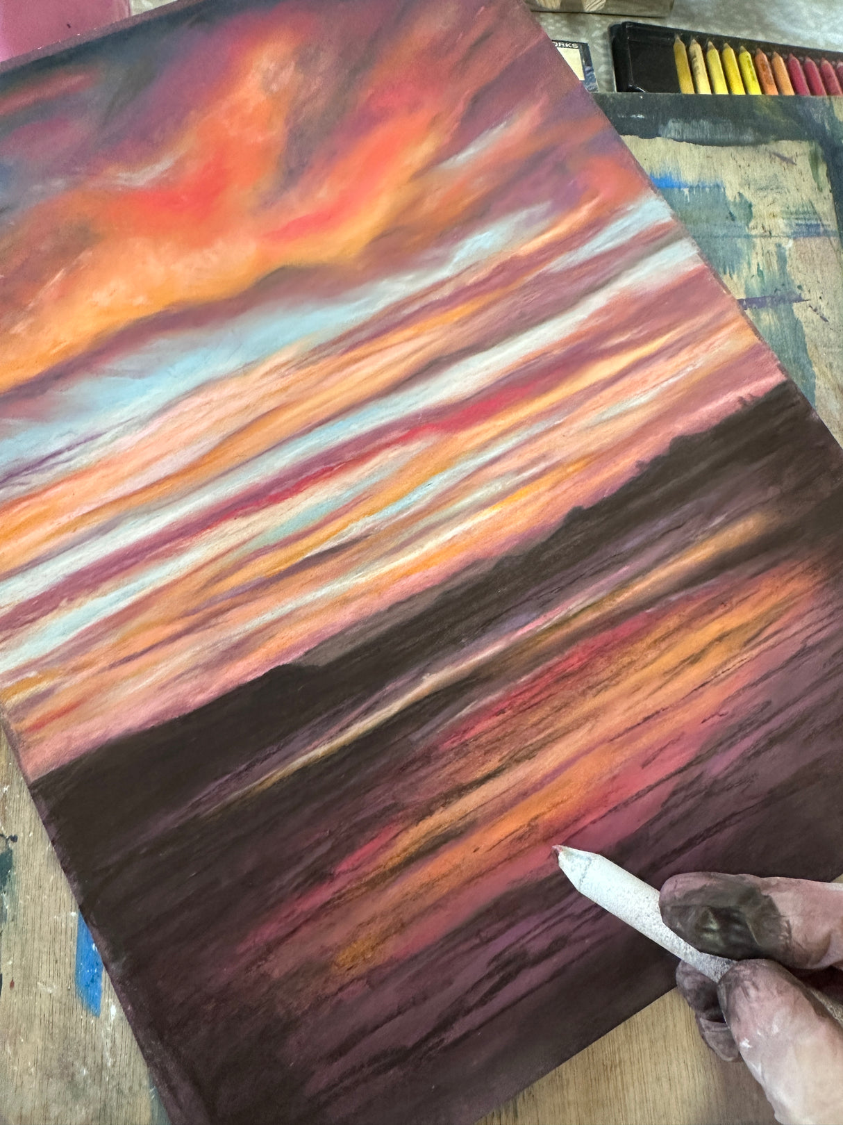 Rich, moody tones capture the beauty of a coastal sunset in this framed artwork.