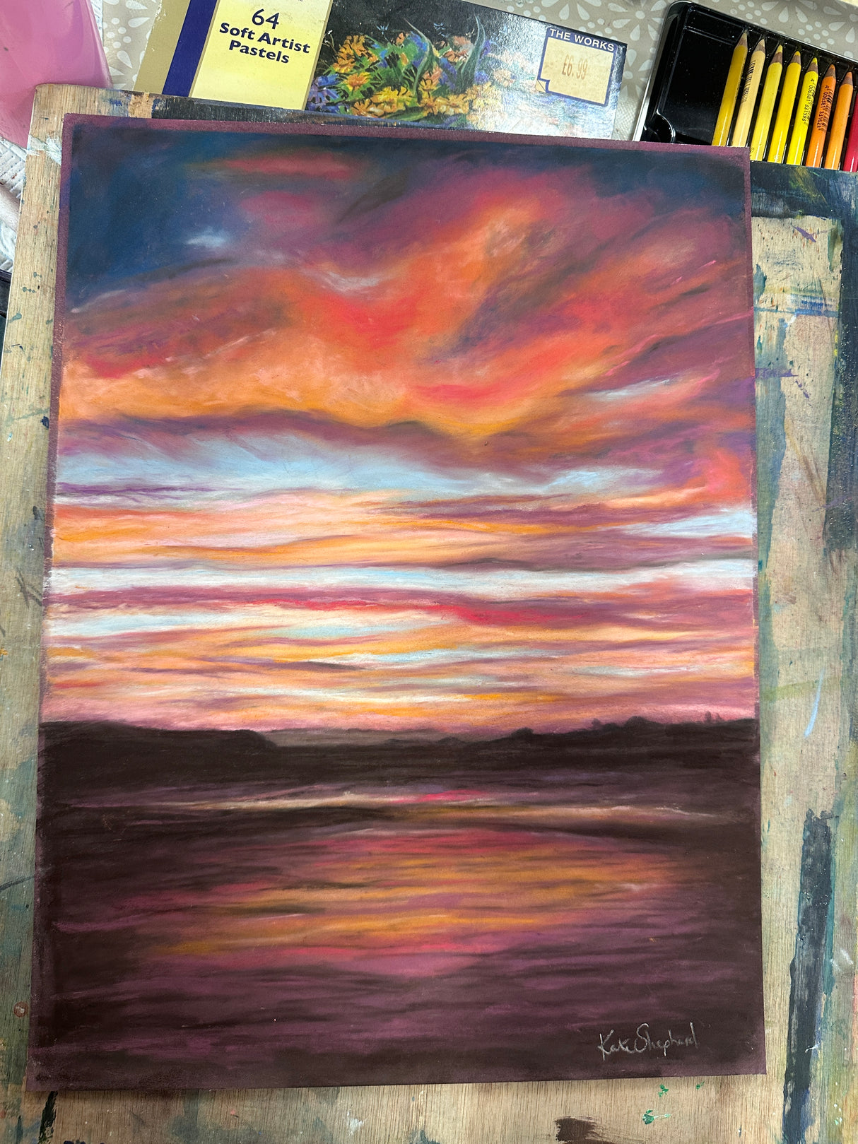 Kate Shephard’s original pastel painting of Poole Bay’s stormy sky, framed and ready to display.