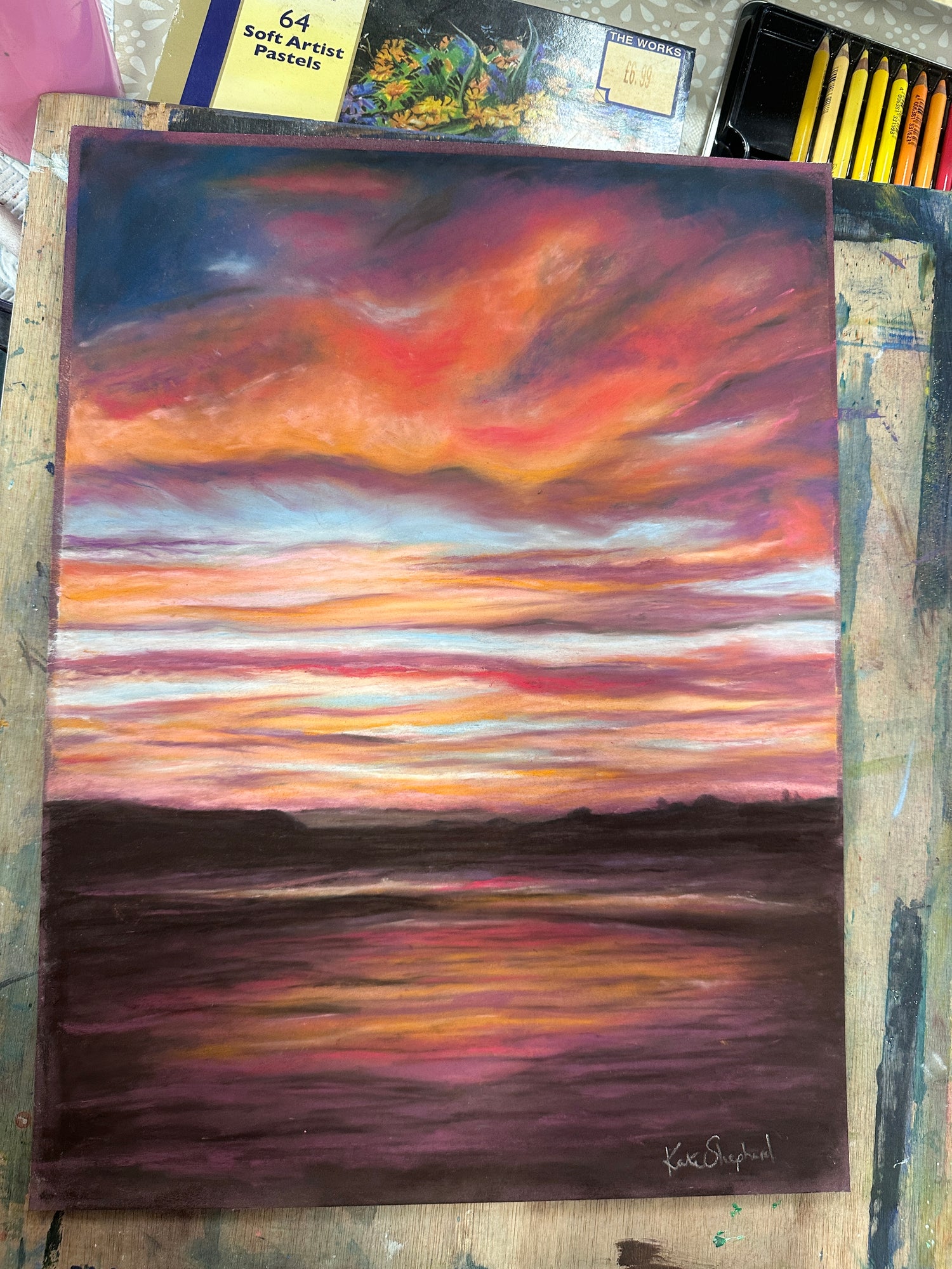 Kate Shephard’s original pastel painting of Poole Bay’s stormy sky, framed and ready to display.