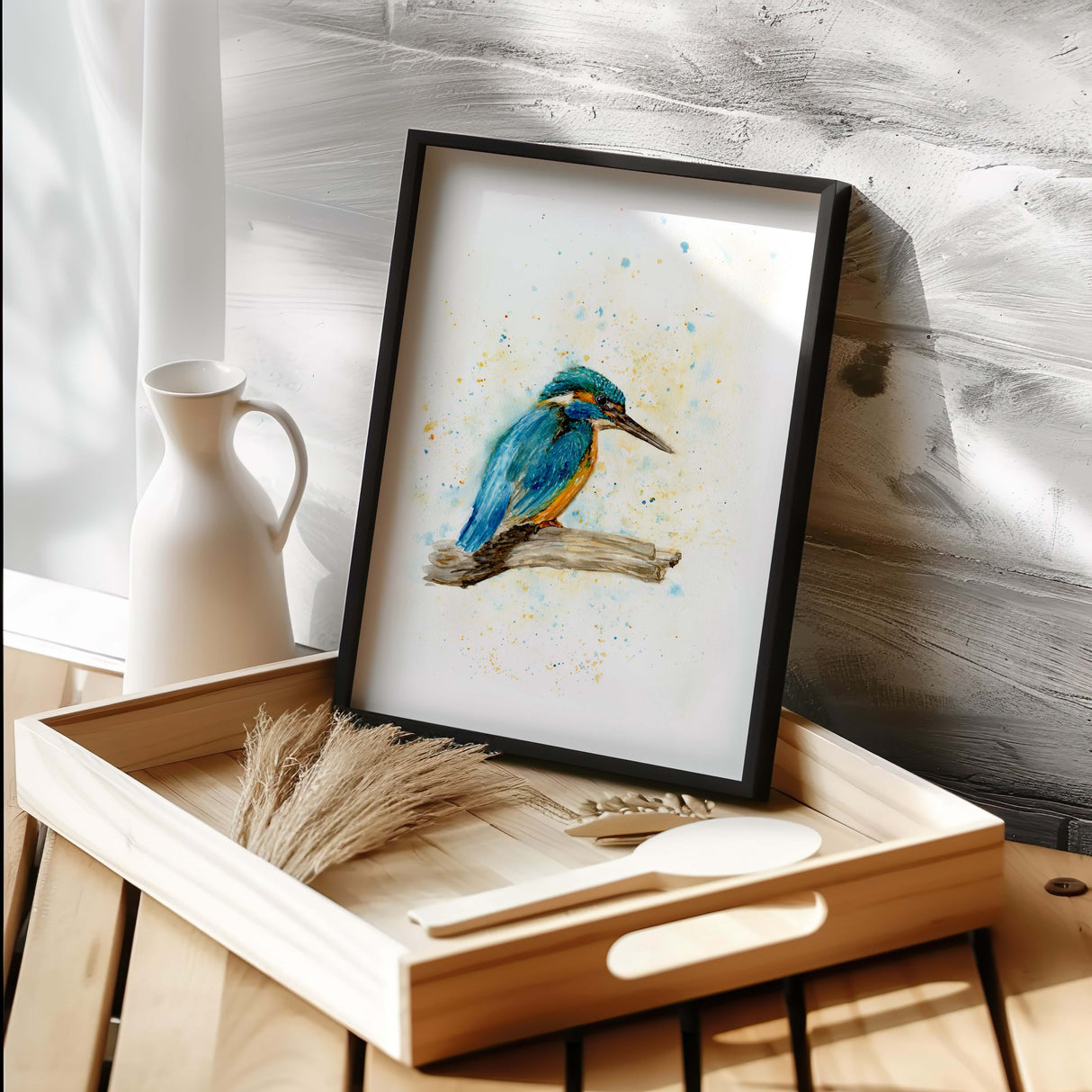 Delicate kingfisher artwork showing the bird resting quietly on a branch. Expressive watercolour kingfisher in blue and orange perched on wood.