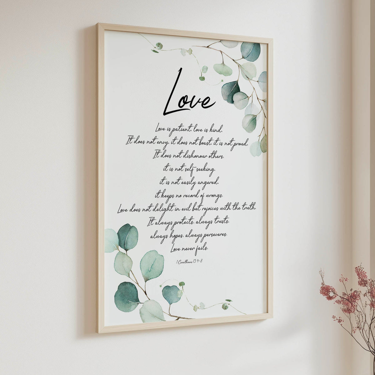 Botanical Bible verse print with elegant green foliage surrounding a passage from 1 Corinthians 13.