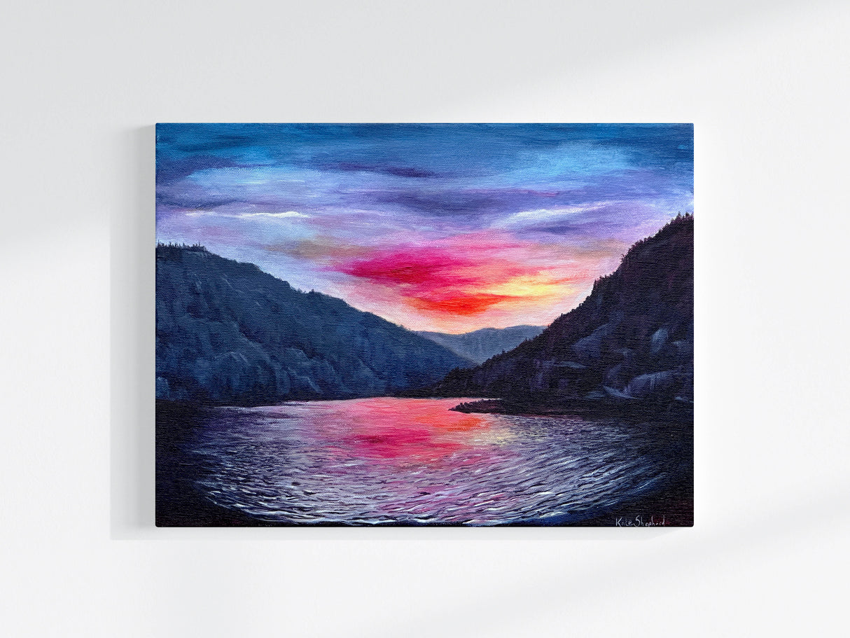 Original acrylic painting of a sunset lake with distant mountains, painted in warm red, orange, and blue hues.