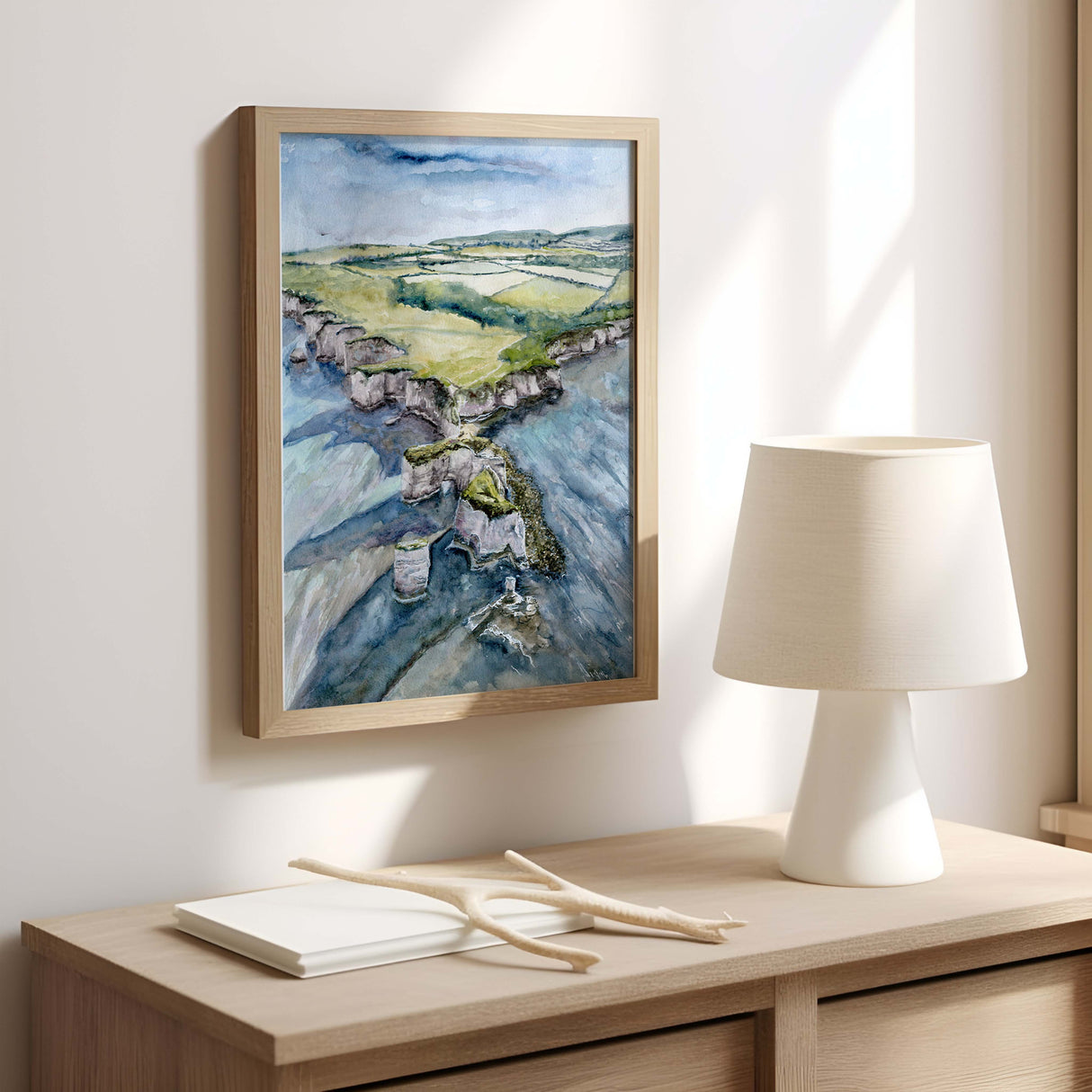 Green and blue watercolour print of the Dorset coastline