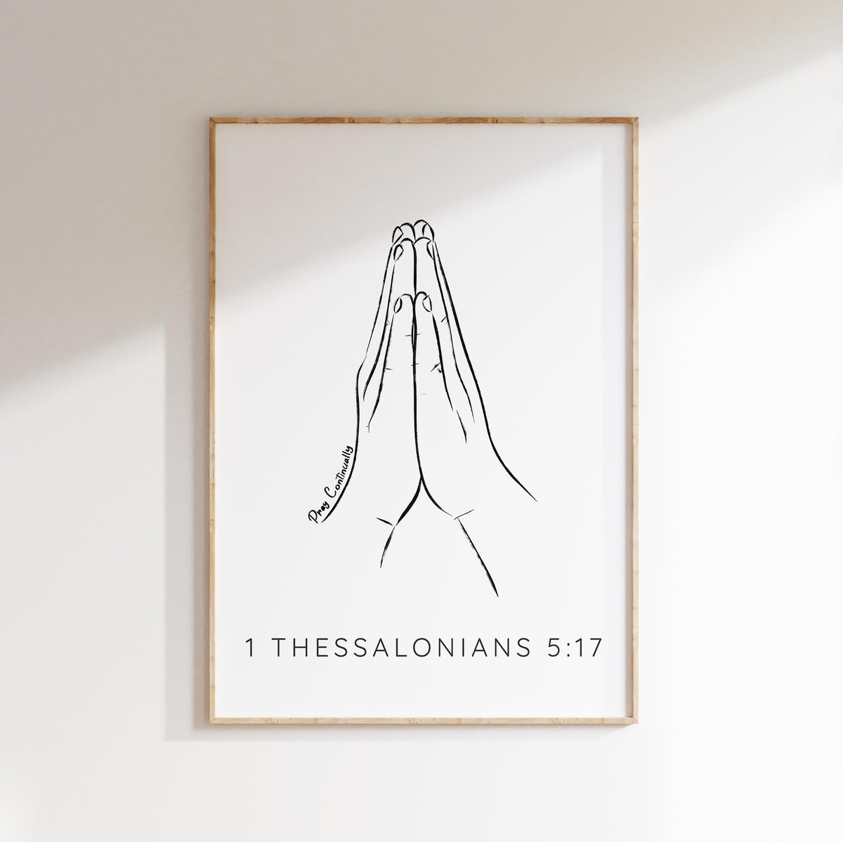 Grace your space with a minimalist 1 Thessalonians 5:17 print - praying hands and 'Pray Continually' quote, a symbol of faith.