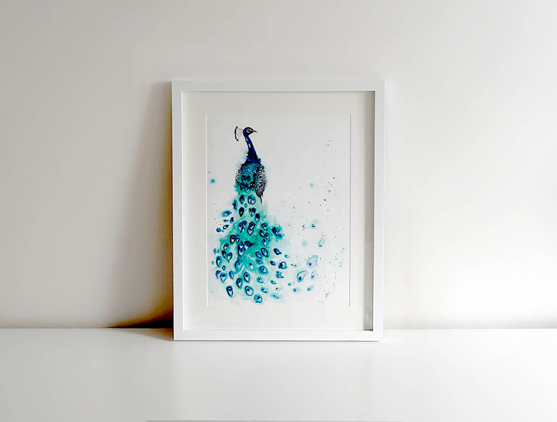 Original peacock watercolor art featuring rich cobalt blues, emerald greens, and hints of gold, highlighting the bird’s graceful plumage.