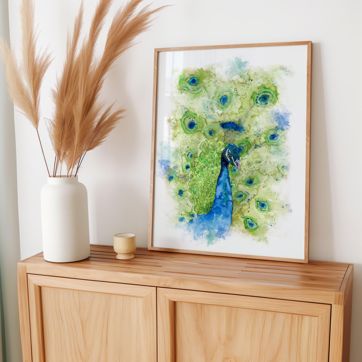 Close-up watercolour peacock portrait in turquoise, green, and blue tones for bold, elegant wall art. Peacock art print featuring detailed head and feathers in vibrant, flowing watercolour hues.