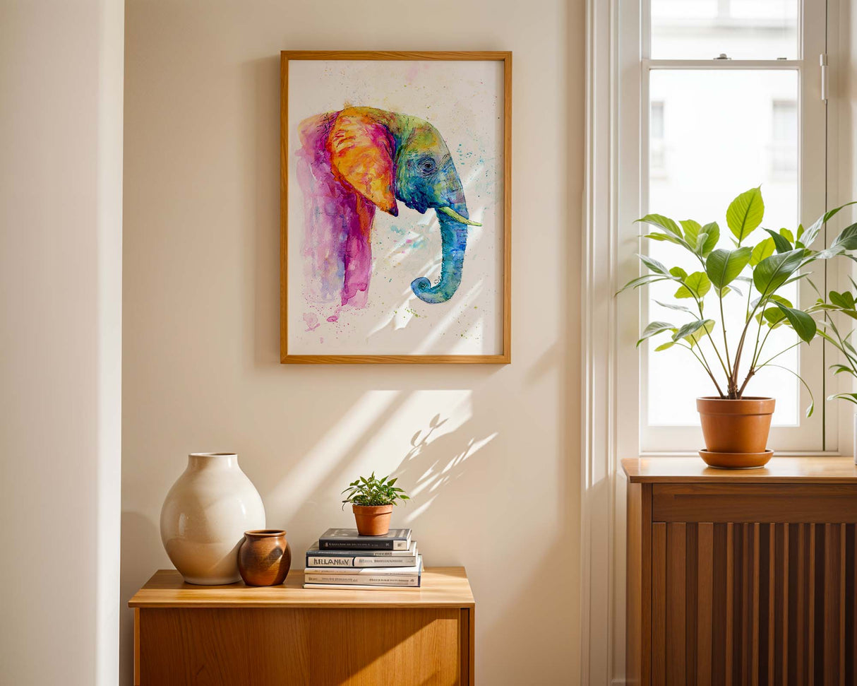 Colourful elephant painting with pink, blue, green, and yellow hues in loose watercolour style.