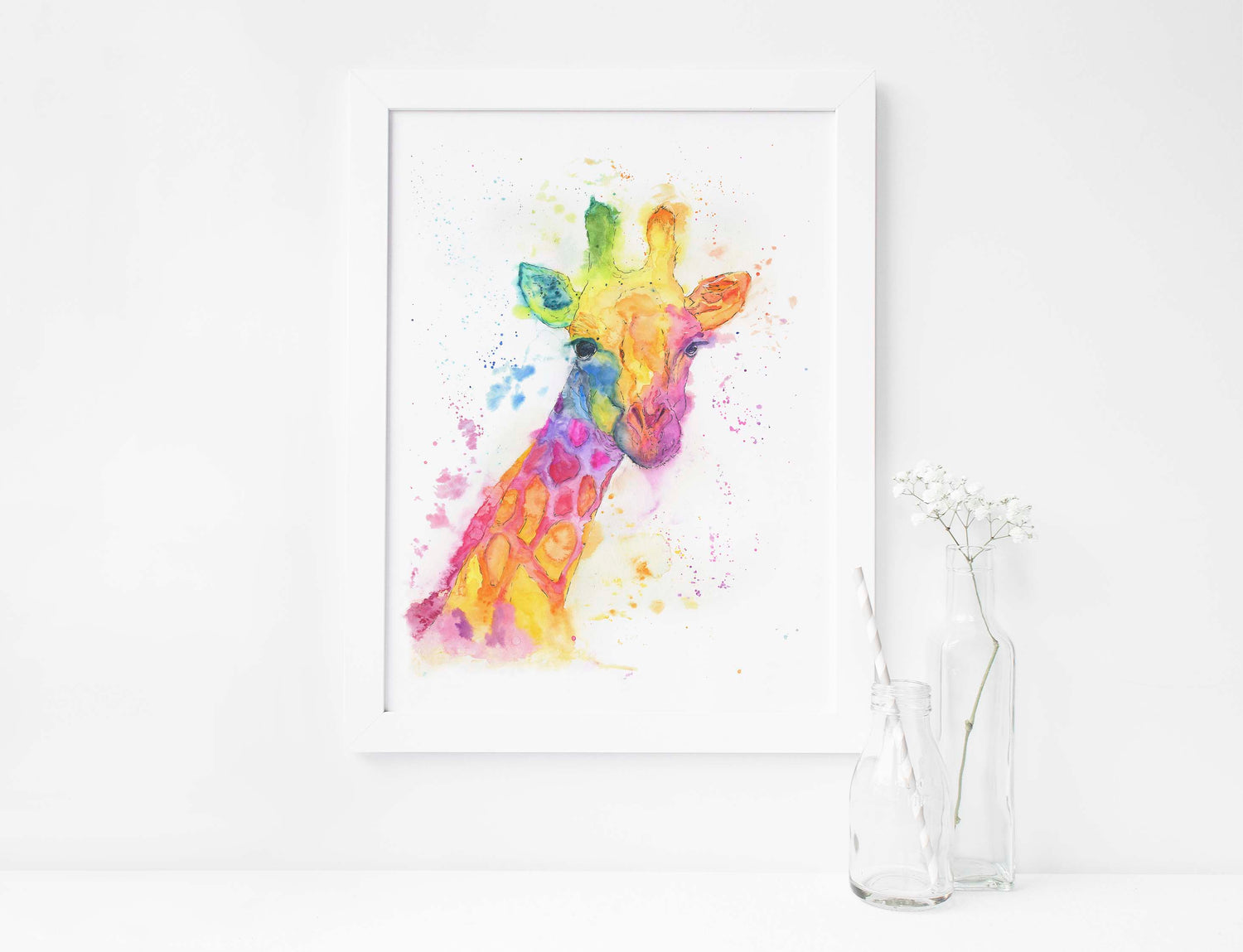 Hand-painted rainbow giraffe print with a joyful, whimsical animal theme. Modern nature wall art print showing a giraffe in a bold, loose rainbow watercolour style.