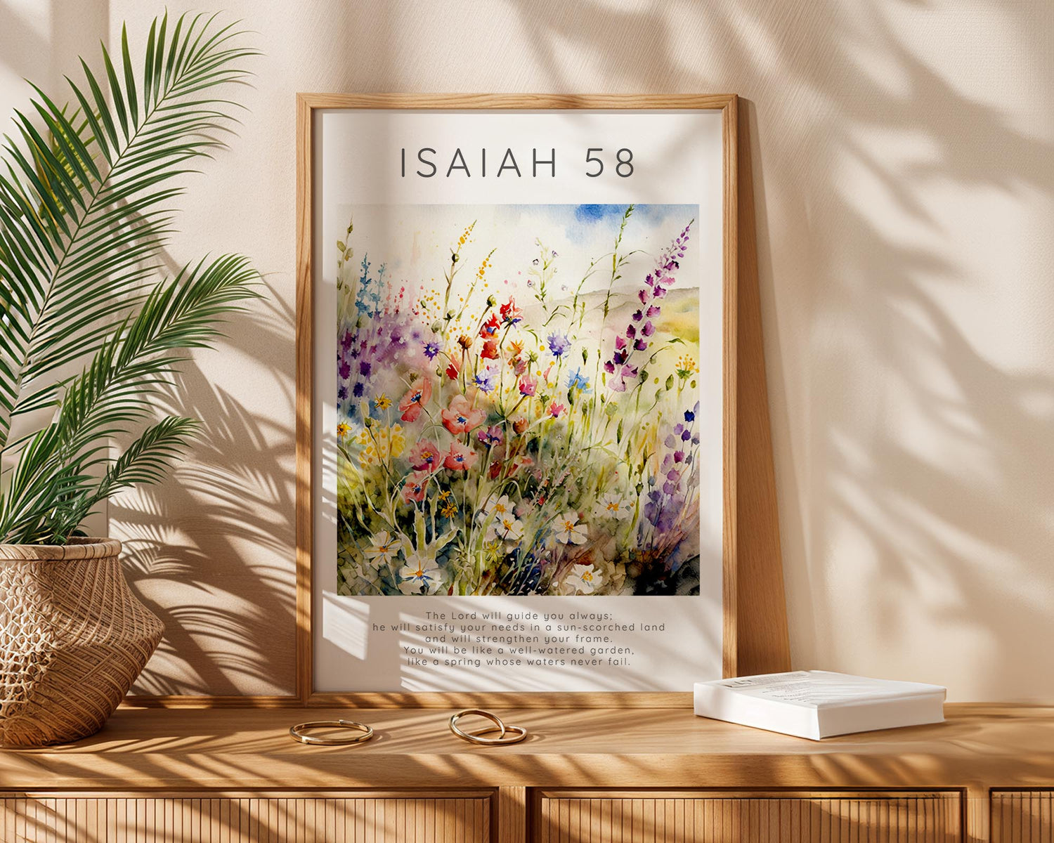 Christian wall art print with Isaiah 58:11, featuring a serene flower meadow and the verse “The Lord will guide you always” at the bottom.