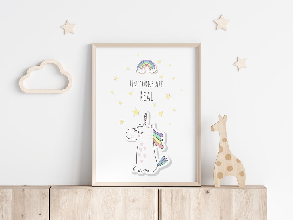 Add a touch of fantasy to your home with a captivating unicorn print, complete with a vibrant rainbow and the heartfelt message 'Unicorns are Real.'