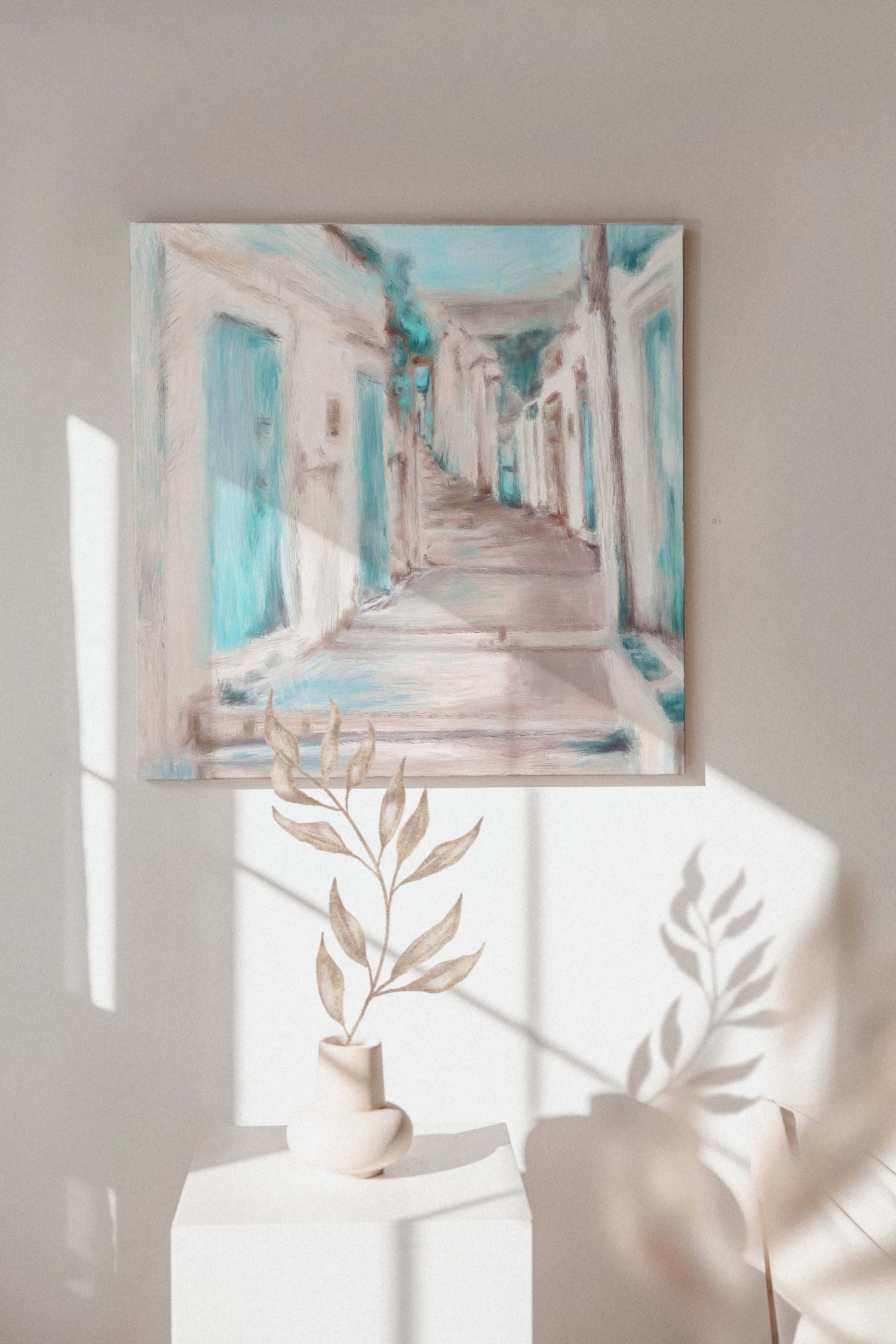 Sand, teal, and white tones in a minimalist painting of Greek holidays