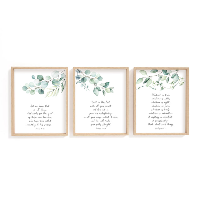 Botanical scripture wall art with eucalyptus leaves and Romans 8:28 verse.