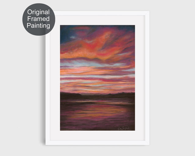 Framed pastel painting of a stormy sunset over Poole Bay from Whitecliffe, featuring red, orange, blue, and dark brown tones.
