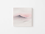 Soft blush tones and simple mountain design in wall art print.