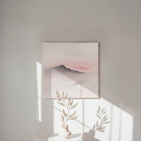 Minimalist landscape print featuring soft muted colours and a pink sky.