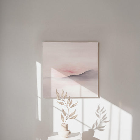 Abstract hill landscape in muted blush and grey tones.