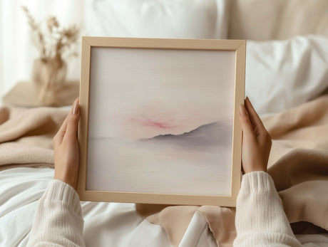 Hill and sky artwork in soft neutral colours.