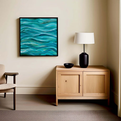 Ocean wall art featuring flowing wave patterns in blues and whites.