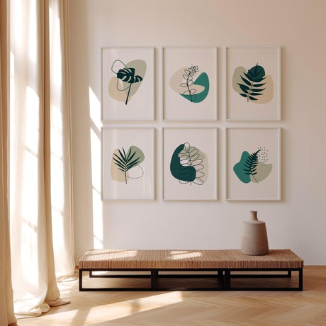 Nature-inspired line art prints featuring detailed botanical illustrations in harmonious jade and sage green tones, perfect for adding calm to a modern interior.