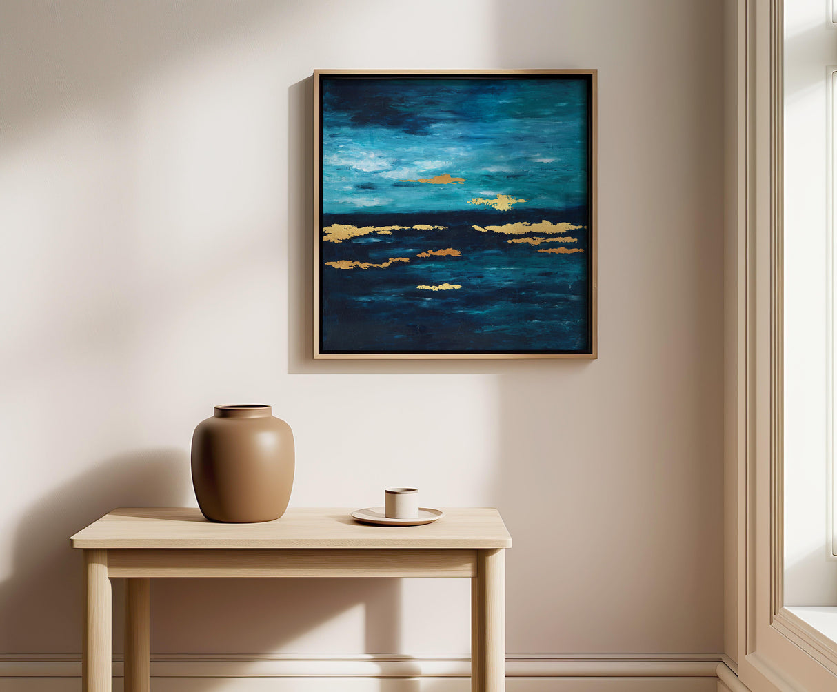 Blue and turquoise abstract seascape artwork featuring gold leaf accents for elegant coastal decor.

