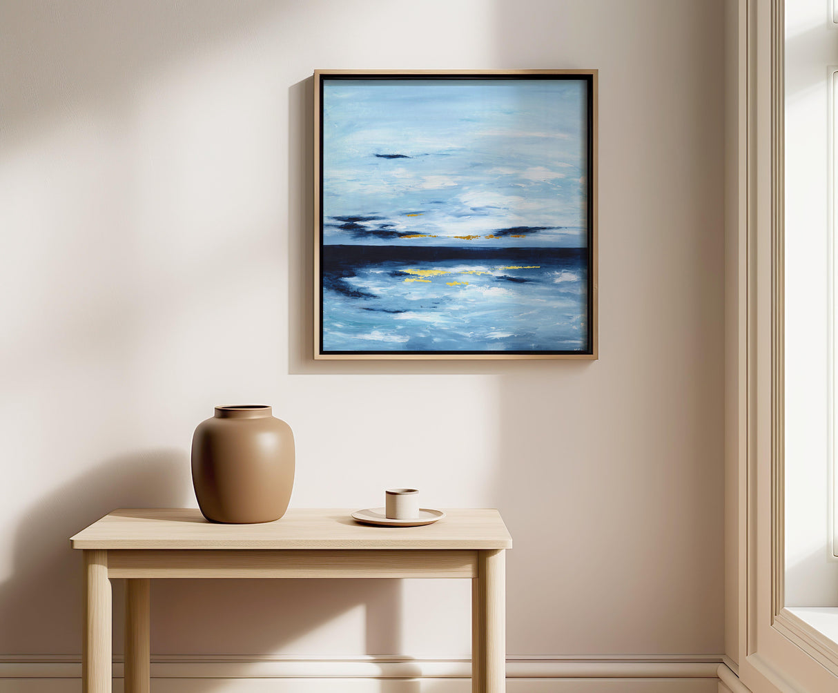 Abstract seascape painting ‘Golden Horizons’ featuring soft blues, whites, and shimmering gold leaf accents.