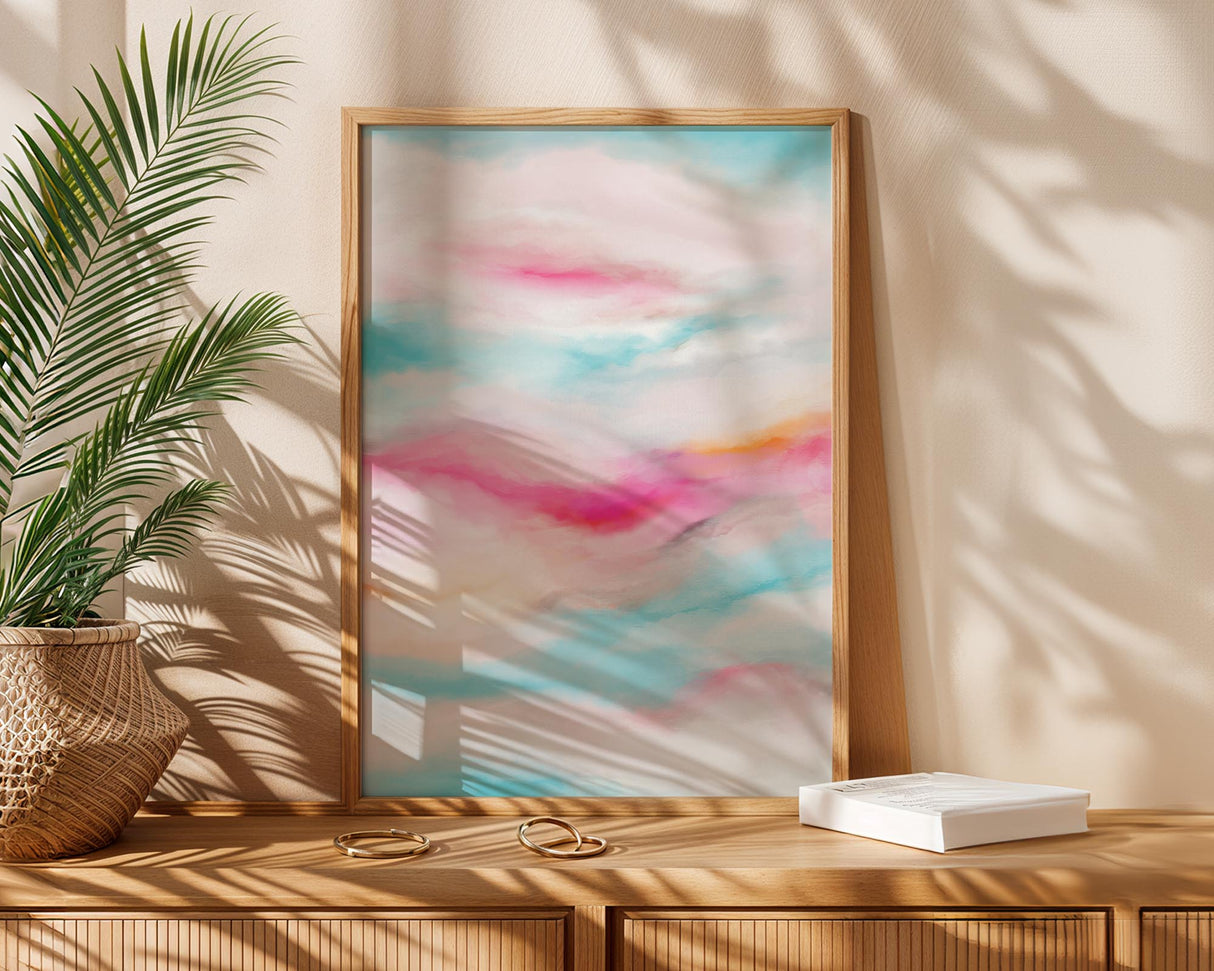 Colourful abstract art print evoking a glowing sunset in pink, blue, and yellow hues