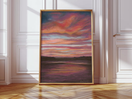 Print of a moody sky over Poole Bay, featuring red, orange, dark brown, and blue pastel hues.