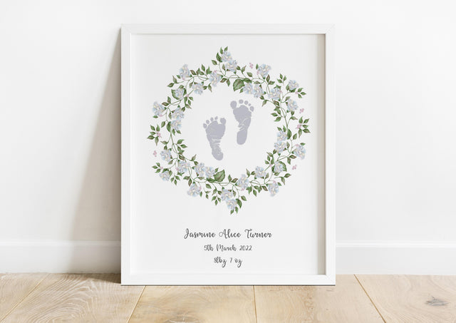 Unique baby footprint birth details artwork, Colorful baby footprint print surrounded by green leaf and white flower wreath