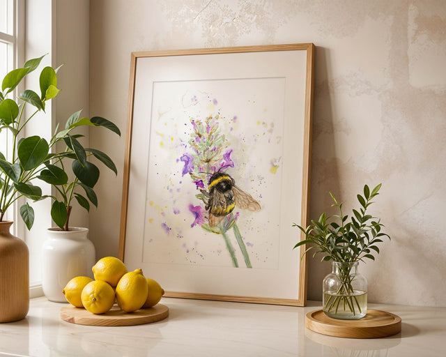 Nature-inspired wall art featuring a detailed bumblebee resting on lavender petals. Hand-painted watercolour print of a bumblebee among lavender flowers, full of charm and movement.