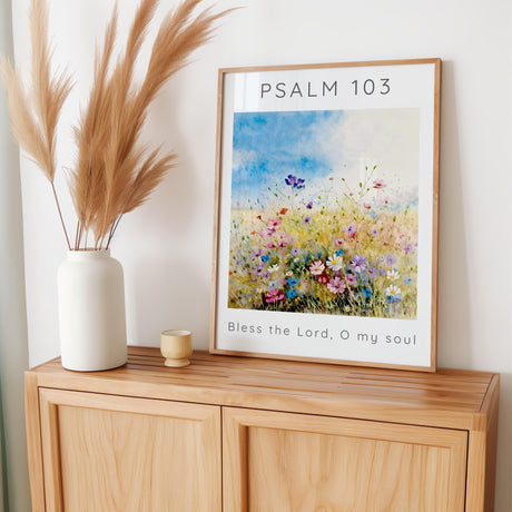 Inspirational Bible verse artwork with Psalm 103 text layered over a peaceful meadow of pastel-coloured wildflowers.