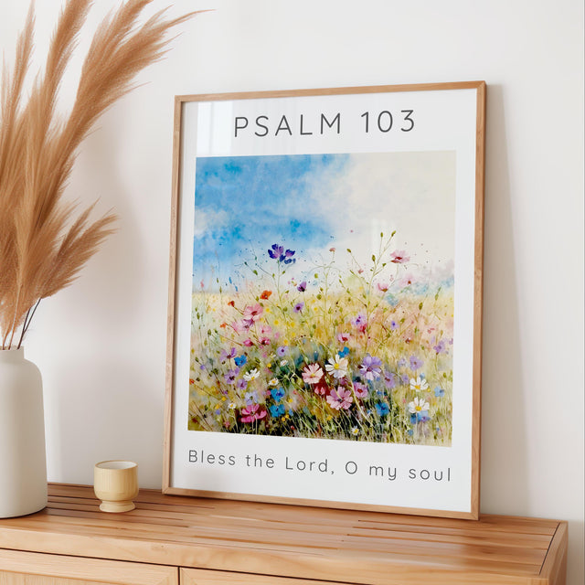 Inspirational Bible verse artwork with Psalm 103 text layered over a peaceful meadow of pastel-coloured wildflowers.