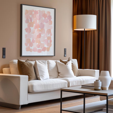 Contemporary abstract print with muted pink hues and gentle brushstrokes.