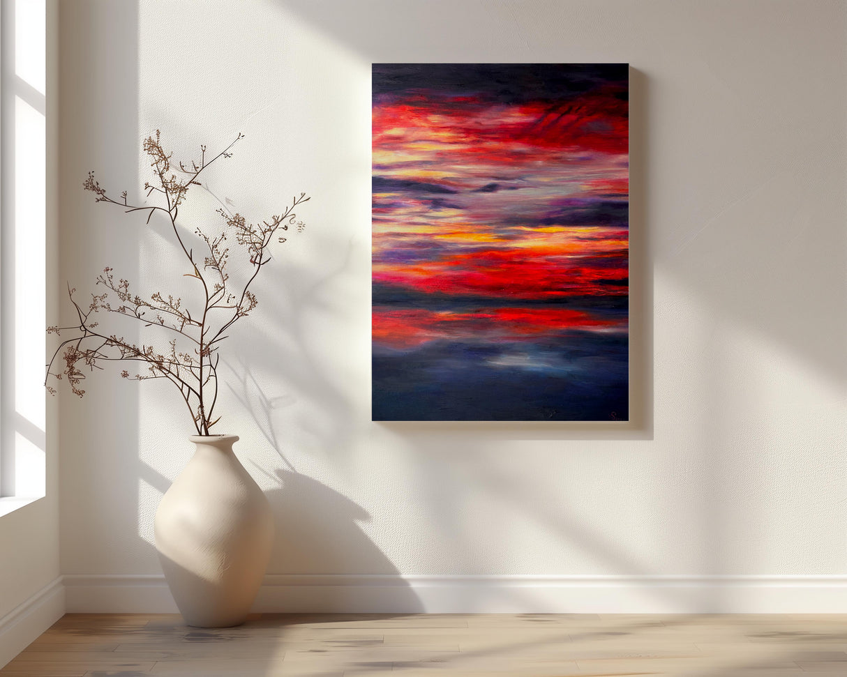 "Midnight Embers" – An abstract seascape painting featuring deep indigo blues contrasted with vibrant hues of orange, red, and yellow. The colors blend and flow together, evoking the glow of embers reflecting on the ocean at night, with a rich sense of movement and depth. 