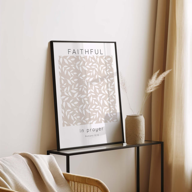 Romans 12:12 wall art print in beige and white with leaf design and the phrase “Faithful in Prayer” in elegant script