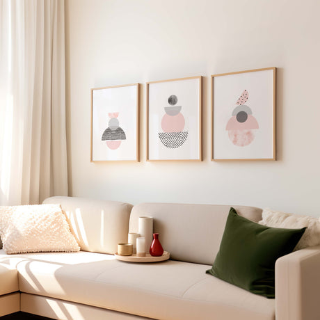 Modern abstract art set with three coordinating prints, each showcasing unique hand-drawn pink and grey shapes against a white backdrop.