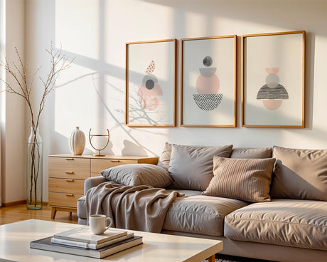 A set of three hand-drawn abstract prints featuring geometric pink and grey shapes on a clean white background.