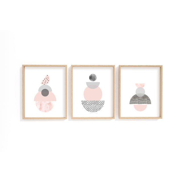 Minimalist geometric shape wall art set of three, with hand-drawn pink and grey abstract forms on white backgrounds.