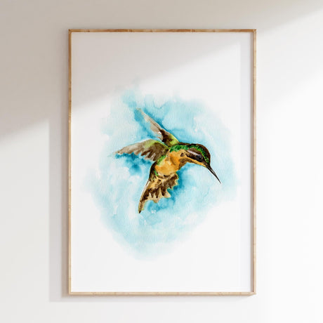 Whimsical wall art print of a hummingbird in calming green and blue tones. Hummingbird wall art print perfect for bird lovers and nature-inspired interiors.