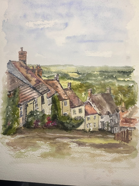 Original watercolour painting of a historic Dorset street with blue sky and rustic houses.